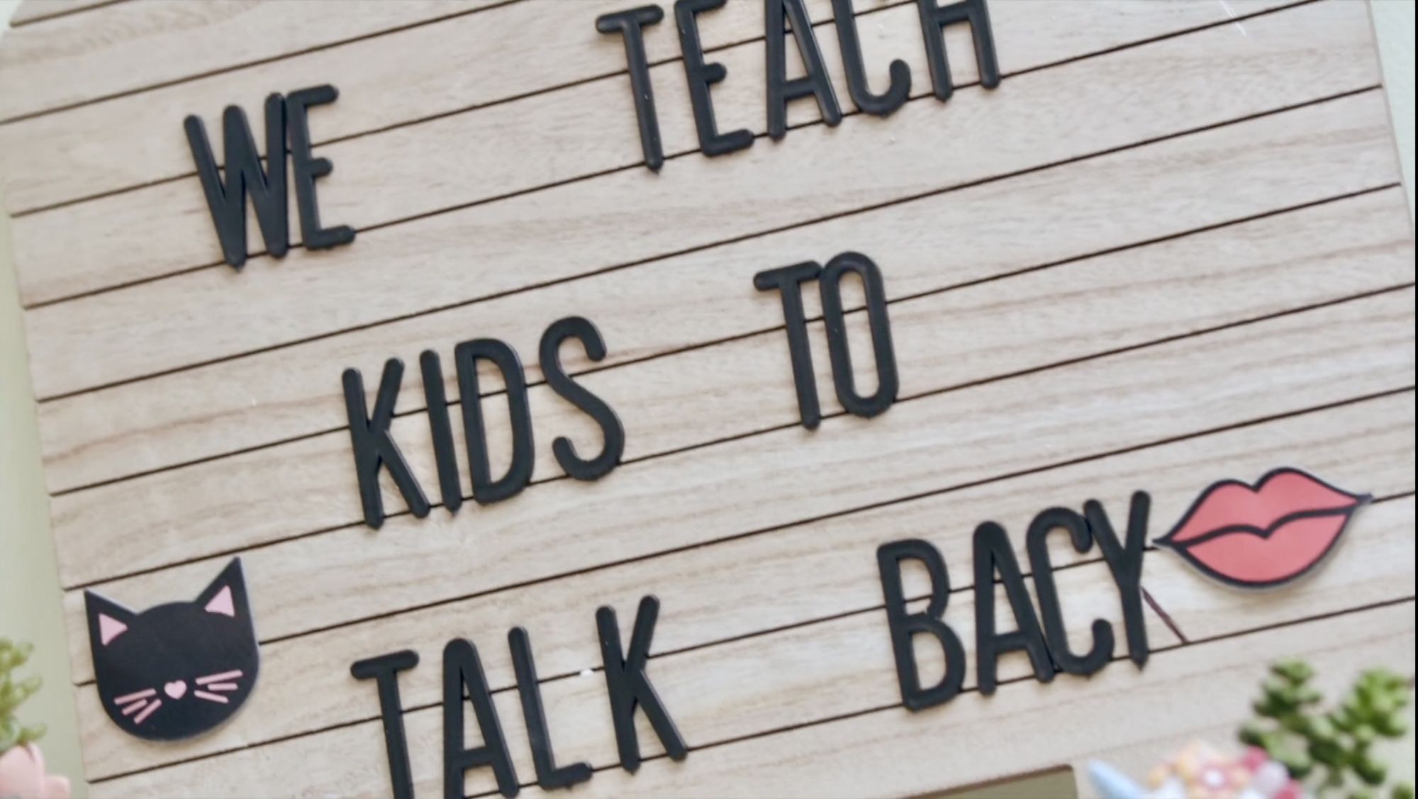 Speech therapy sign that says "We teach kids to talk back"